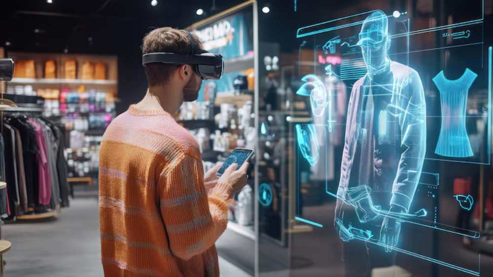 A man wearing VR goggles interacts with a holographic display of clothing using AR app in a modern retail store.
